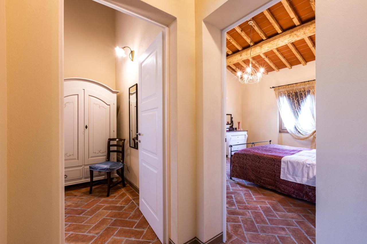 Appartamento in casale con piscina Casa I Pavoni Chianni Esterno foto
