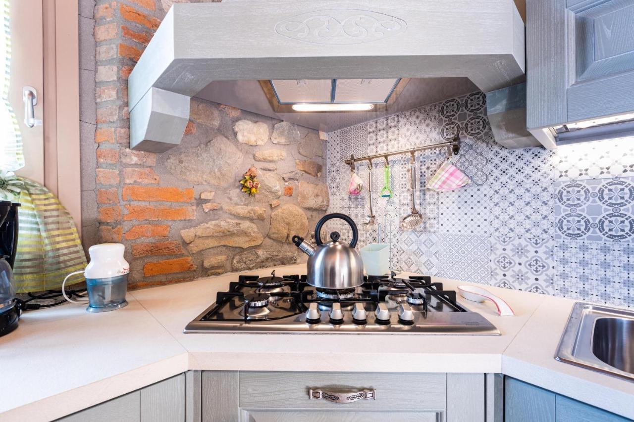 Appartamento in casale con piscina Casa I Pavoni Chianni Esterno foto
